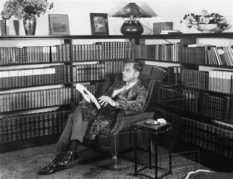 Man Sitting In His Library Reading A Book Stock Photo Dissolve