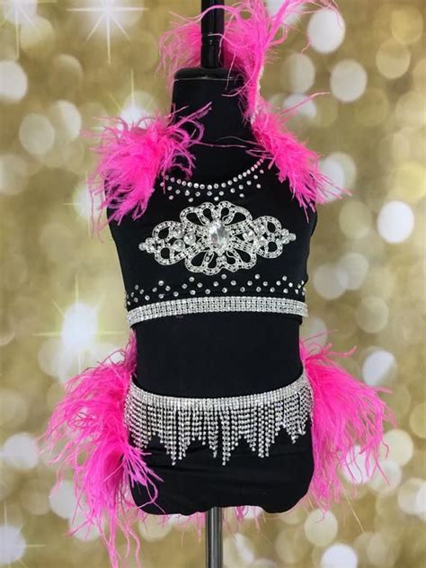 A Black Top With Pink Feathers On It