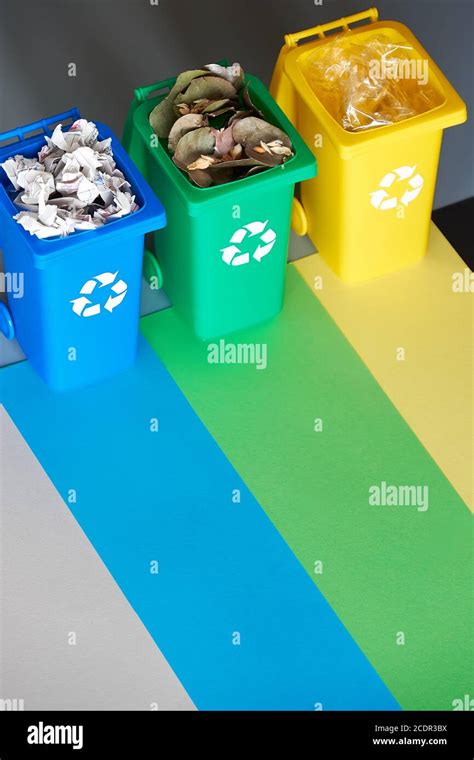 Three Color Coded Recycle Bins Isometric Picture On Geometric Paper