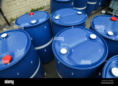 Chemical Plant, Plastic Storage Drums outdoor toxic barrel Stock Photo - Alamy