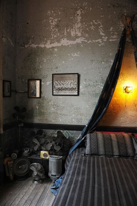 Masculine bedroom with antique industrial objects.