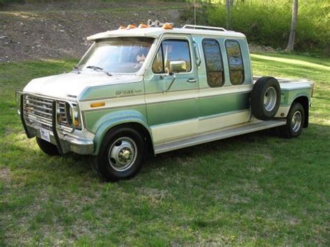 An Old Pick Up Truck Is Parked In The Grass