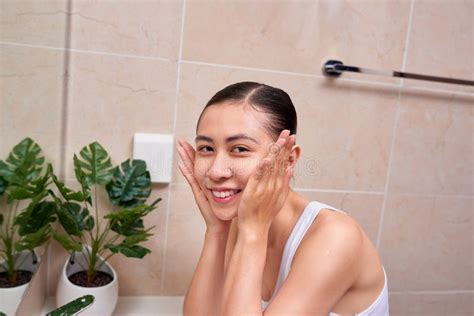 Young Vietnamese Girl Enjoy Herself With Bubble Cleansing Foam Stock