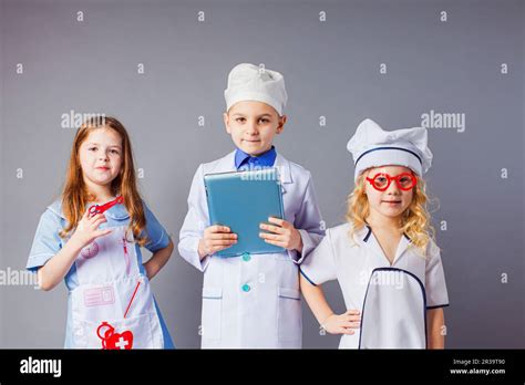 Kids Imagine Future Profession Cute Little Doctors On Grey Background
