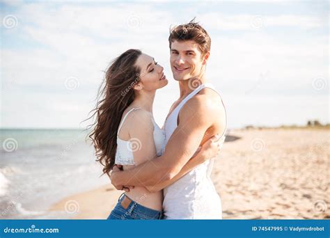 Couple Standing And Embracing On The Beach Stock Image Image Of Beach