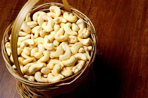 Roasted Salted Raw Cashew Nuts In Wooden Bowl On Rustic Table Healthy