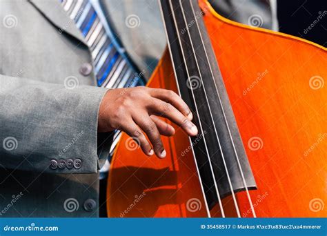 Man Playing A Double Bass In An Orchestra Royalty Free Stock ...