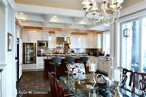 Open Layout Dining Room And White Kitchen With Stainless Steel