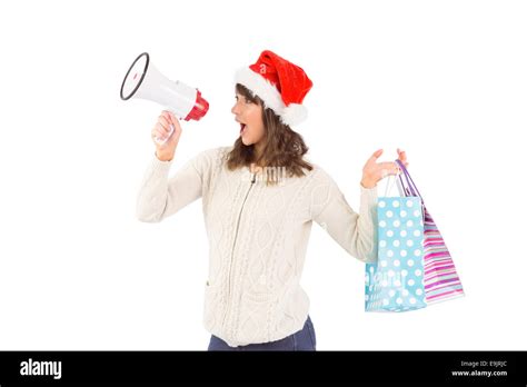 Festive Brunette Holding Megaphone And Bags Stock Photo Alamy