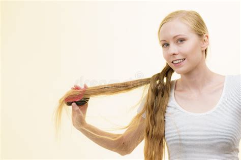 Blonde Girl Brushing Her Long Hair Stock Image Image Of Brushing