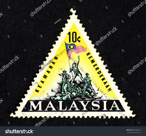 Malaya Circa Yellow Color Triangle Shaped Postage Stamp Printed