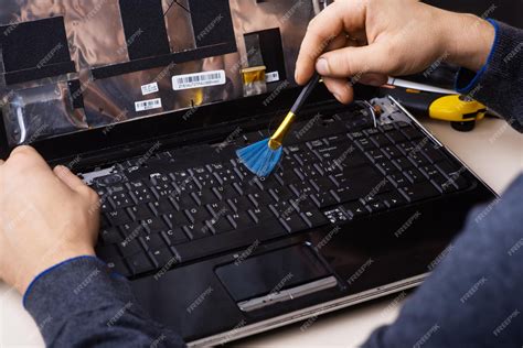 Premium Photo The Wizard Restores The Laptop Disassembly Of The Laptop Into Spare Parts Board