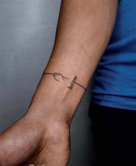 Pin By Manou Krt On Tattoo Wrist Tattoos For Guys Hope Tattoo