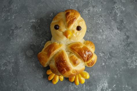 Premium Photo Overhead View Of An Easter Chick Made From Hot Cross Buns