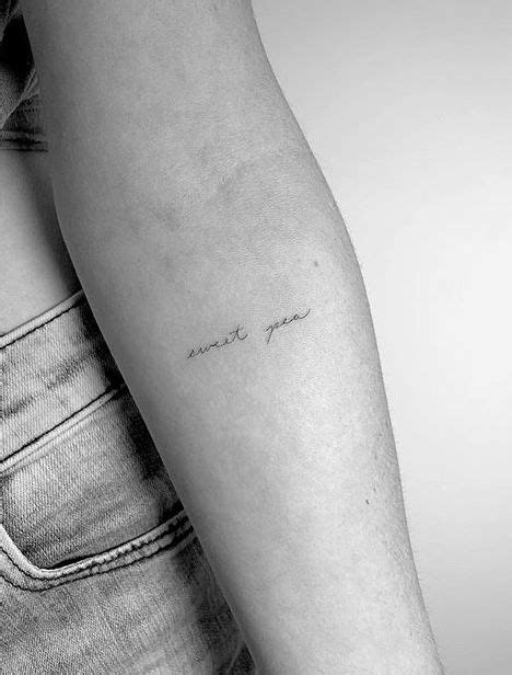 A Woman S Arm With A Small Tattoo That Says I Love You On It