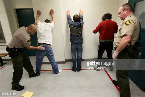 A Sheriffs Deputies Search New Inmates Upon Arrival At The San Diego