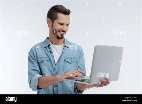 Attentive Brunette Using His Computer Stock Photo Alamy