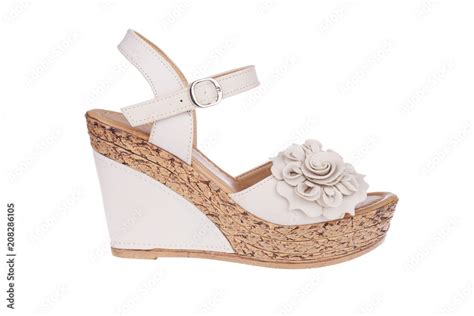 High Heels Shoe In Nude Color With Flower Wedge Platform Sole And Ankle Strap Stock Photo