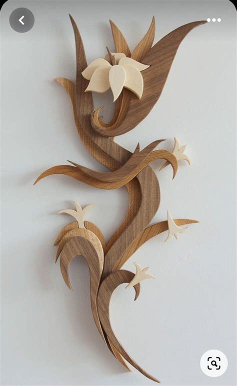 A Wooden Wall Decoration With Flowers On It