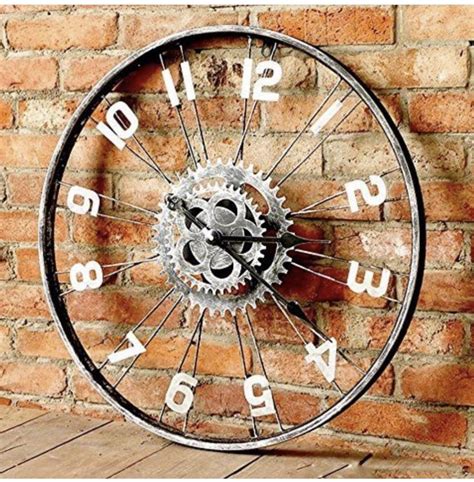 A Clock Made Out Of An Old Bicycle Wheel On A Brick Wall Next To A