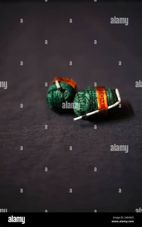 Diwali fire bomb cracker on black backgrounds Stock Photo - Alamy