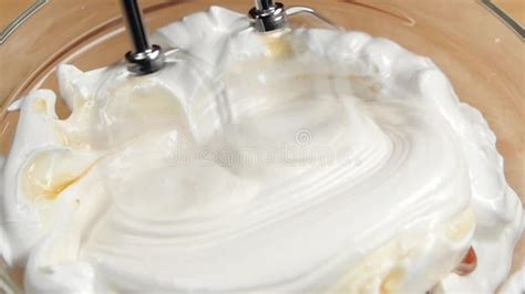 Mixer Whip Cream With Syrup Or Liquid Honey Slow Motion Stock Video