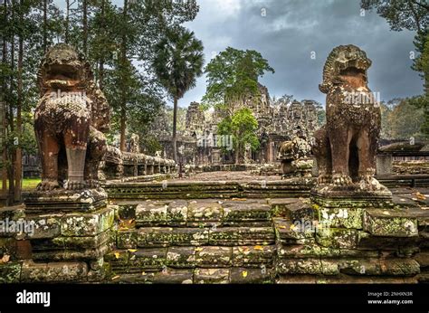 Giant Lions On A Stone Platform Guard An Entrance To The Ruins Of The