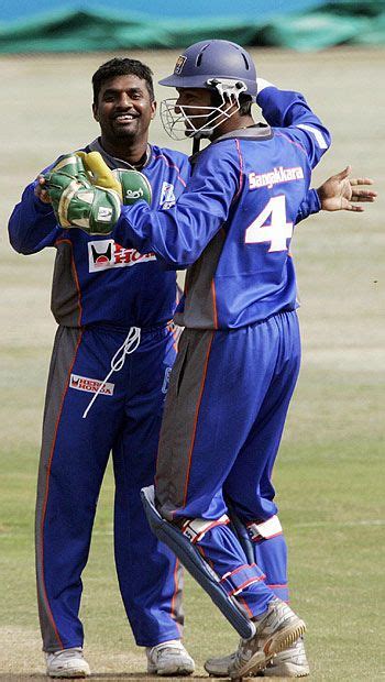 Muttiah Muralitharan And Kumar Sangakkara Celebrate After The Fall Of