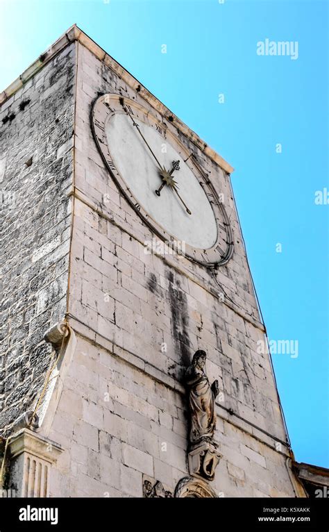 Clock on the ancient tower Stock Photo - Alamy