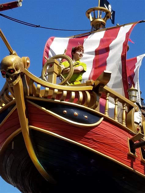 Peter Pan flying the ship through the Festival of Fantasy Parade at ...