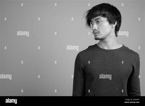 Portrait of young Asian man in black and white Stock Photo - Alamy