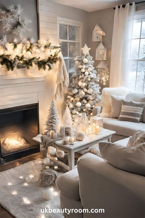 A Living Room Decorated For Christmas With White And Silver Decorations