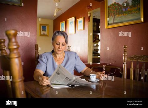 Mature Woman Reading A Newspaper Stock Photo Alamy