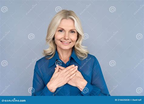 Portait Of Happy Contented Adult 50 Years Old Woman Isolated On Grey