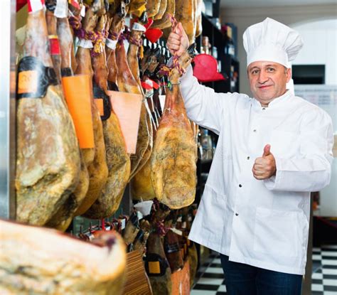 Portrait Of Mature Shop Man Offering Spanish Jamon Stock Image Image