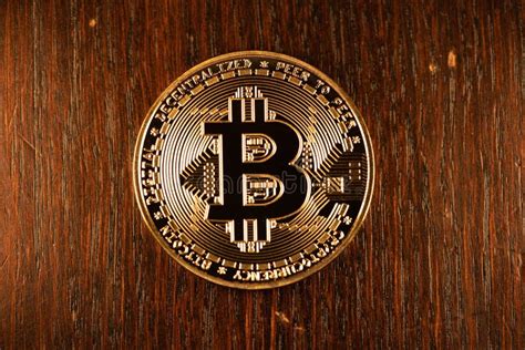 Gold Bitcoin Physical Coin On Wooden Background Shining Digital