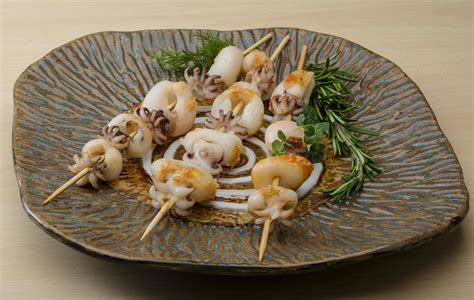 Grilled Cuttlefish On The Plate And Wooden Background 12268856 Stock