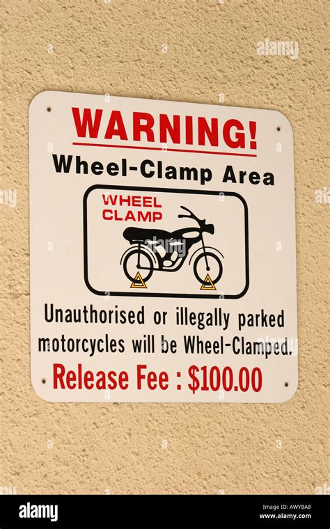 Wheel clamp sign hi-res stock photography and images - Alamy