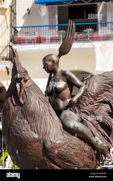 Large Bronze Sculpture Of A Naked Woman Riding A Rooster With A Fork In