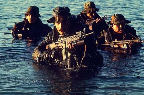 Us Navy Seal Team Emerges From Water Photograph By Everett Fine Art