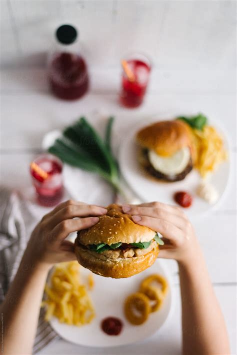 Anonymous Person Eating A Beef Burger By Stocksy Contributor Brkati Krokodil Stocksy