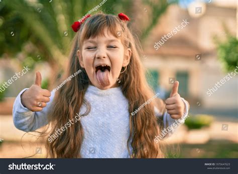 Adorable Caucasian Child Girl Tongue Out Stock Photo 1975647623