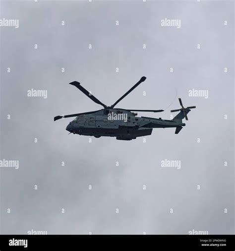 A Merlin Mk 4 Helicopter Approaching Hms Condor Flying Low Heading Into
