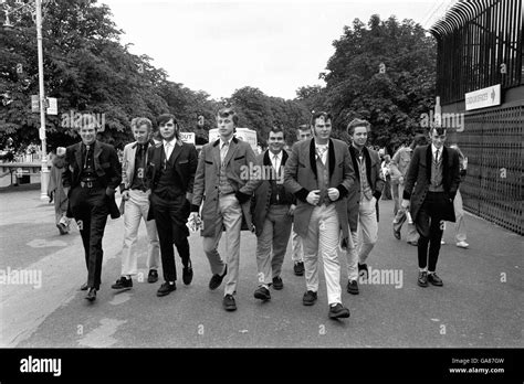 Teddy Boys Arrive For The Rock Revival Festival Wearing Long Jackets Hi