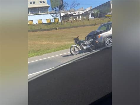 Driver Flees Hit And Run With Motorcycle Still Attached To Hood