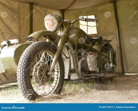 A Military Motorcycle With A Sidecar Under An Awning Military