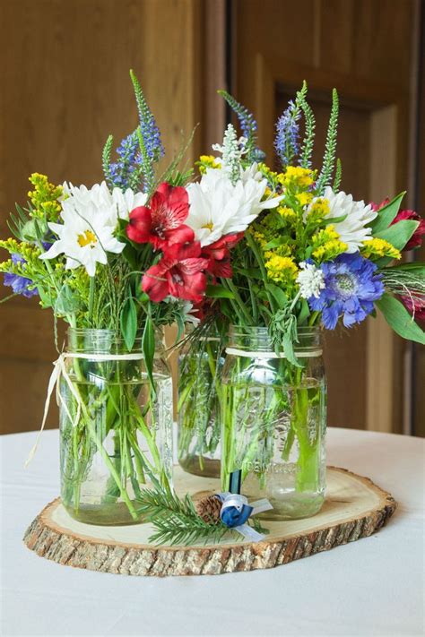 The Knot Yours Truly Wildflower Centerpieces Blue Centerpieces