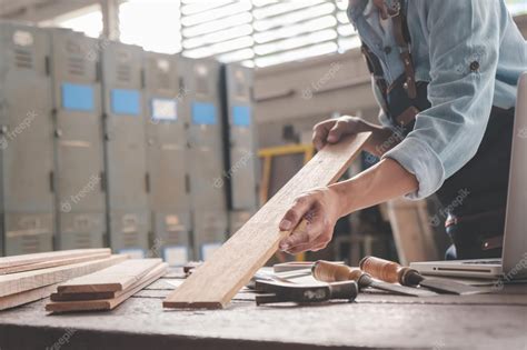 Premium Photo Carpenter Working With Equipment On Wooden Table In