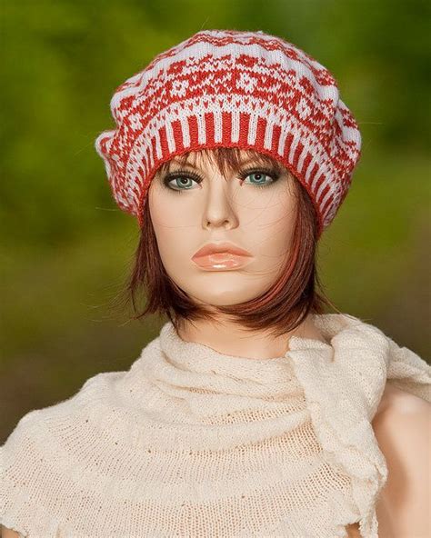 A Mannequin Wearing A Red And White Knitted Hat