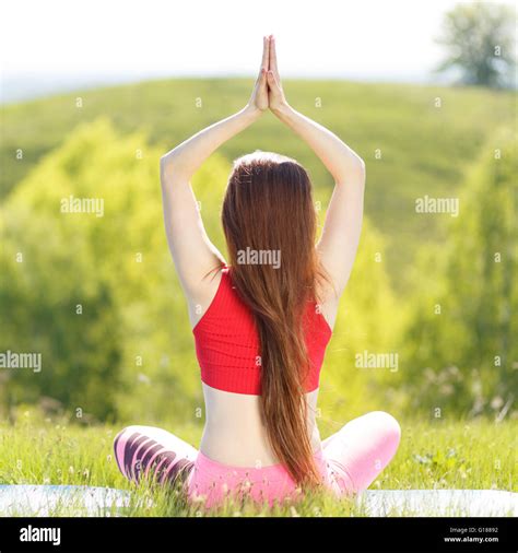 Young Woman Doing Yoga Lotus Pose With Namaste In The Morning Girl